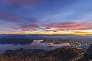 Lake Wanaka and Wanaka City during sunrise, view from Roys Peak, South Island, New Zealand - FOF11820