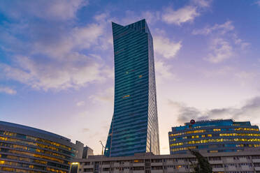 View to apartment tower at twilight, Warsaw, Poland - TAMF02199