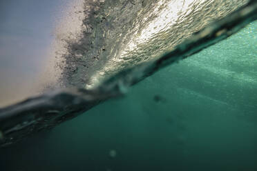 Indonesia, Bali, Underwater view of ocean wave - KNTF04299