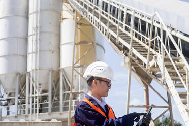 Concrete worker with helmet in concrete factory - CAVF74577