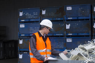 Worker young male with helmet outside working - CAVF74578