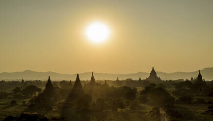 Sunset over stupas of temples in Bagan, Myanmar. - MINF13423