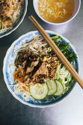 High angle close up of Bun thit nuong-rice noodles with grilled pork and fresh herb. - MINF13494