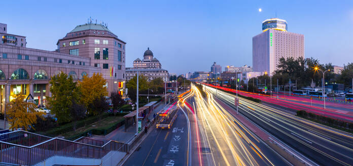 Traffic trail lights on major road near Beijing Zoo at dusk, Beijing, People's Republic of China, Asia - RHPLF13730