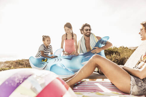 Family relaxing and having fun at the poolside - SDAHF00113