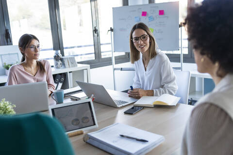 Businesswomen during meeting in an office stock photo
