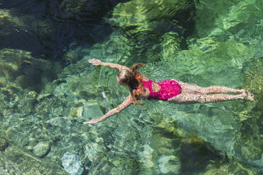 Woman swimming in refreshing Verszasca river - GWF06424