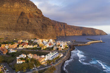 Spain, Canary Islands, La Gomera, Valle Gran Rey, Aerial view of Vueltas and port at sunse - SIEF09505