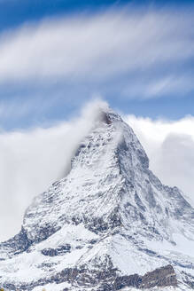 Clouds over Matterhorn covered with snow, Pennine Alps, Zermatt, canton of Valais, Swiss Alps, Switzerland, Europe - RHPLF13856