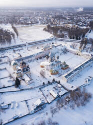 Russia, Leningrad Region, Tikhvin, Aerial view of Tikhvin Assumption Monastery in Winter - KNTF04373