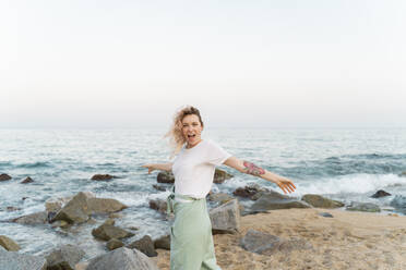 Young woman spending a day at the seaside, having fun on the beach - AFVF05419