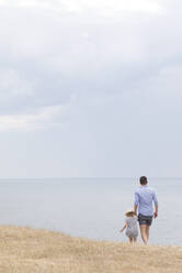 Father with daughter at sea - JOHF07922
