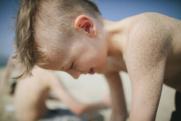 Smiling boy on beach - JOHF08097