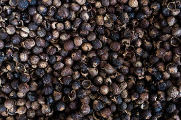 High angle close up of dried brown soap nuts. - MINF13632