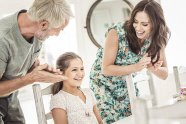 Father and mother celebrating daughter's birthday - SDAHF00234