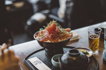 Salmon dish on table - JOHF08323