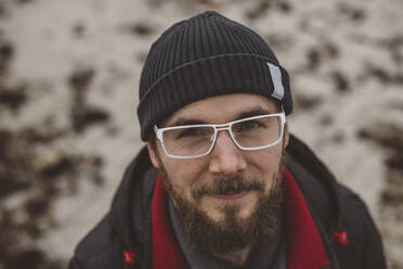 Portrait of young bearded man wearing glasses - JOHF08408