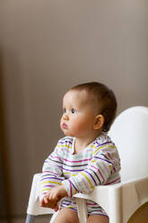 Baby in highchair - JOHF08543