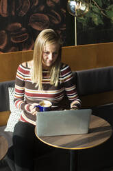 Woman using laptop - JOHF08559