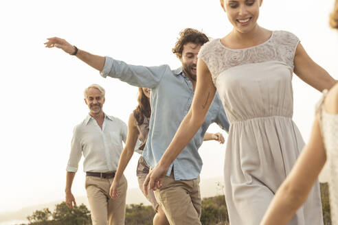 Large family enjoying the sunset on a boardwalk - SDAHF00476