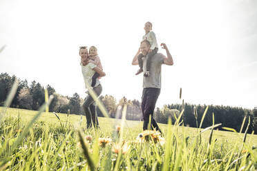 Happy family with two kids on a meadow in spring - WFF00275