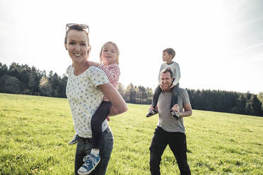 Happy family with two kids on a meadow in spring - WFF00276