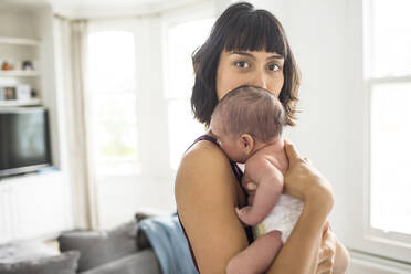 Portrait beautiful mother holding newborn baby son - HOXF04925