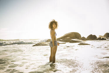 Young woman standing in the sea - SDAHF00504