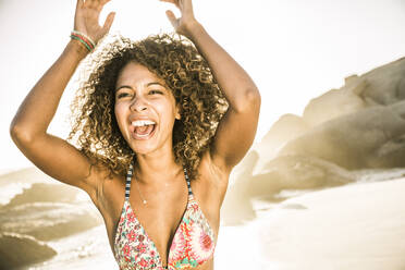 Carefree young woman having fun on the beach - SDAHF00598