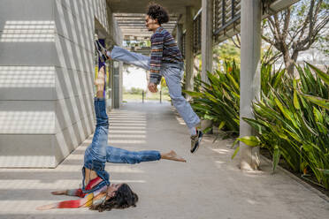 Couple of dancers, dancer jumping and female dancer lifting her legs - DLTSF00518