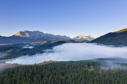 Germany, Bavaria, Krun, Drone view of Barmsee lake shrouded in thick fog - SIEF09547