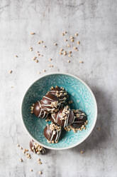 Bowl of chocolate pralines with hazelnut brittle - MYF02250