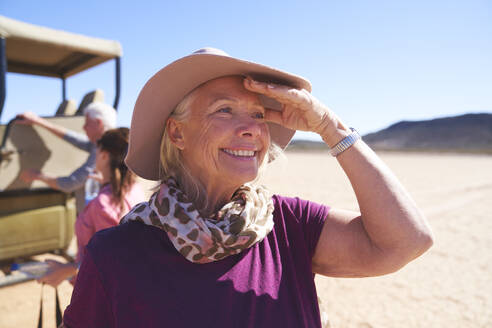 Portrait happy senior woman on safari - CAIF23928
