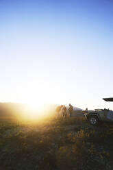 Safari tour group on sunny hill at sunrise South Africa - CAIF24042