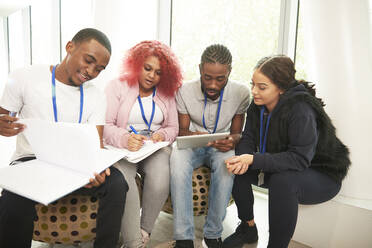 College students with notebooks and digital tablet studying - CAIF24100