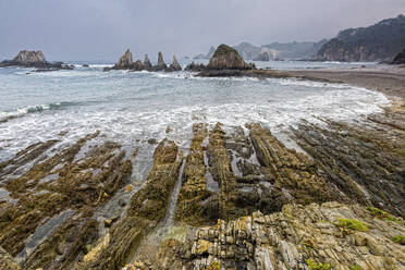 Tranquil rocky ocean beach Gueira Beach Asturias Spain - CAIF24232