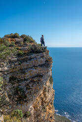 A men on a cliff facing the mediterranean sea - CAVF74771