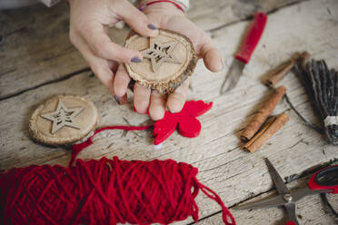 Woman creating Christmas ornaments in shop - ISF23826