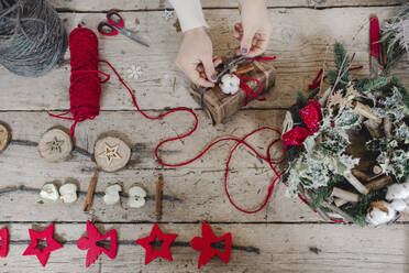 Woman creating Christmas ornaments in shop - ISF23830