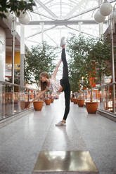Professional ballerina lifting her leg high - CAVF75015