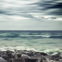 France, Normandy, Port-Bail-sur-Mer, Long exposure of rocky sea shore - DWIF01080