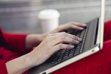 Businesswoman using laptop - JSMF01445