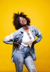 Portrait of happy young woman in studio - DGOF00475