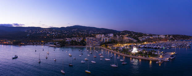 Spain, Balearic Islands, Mallorca, Portals Nous, Puerto Portals, Aerial view of luxury marina at sunset - AMF07884