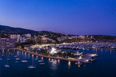 Spain, Balearic Islands, Mallorca, Portals Nous, Puerto Portals, Aerial view of luxury marina at dusk - AMF07885