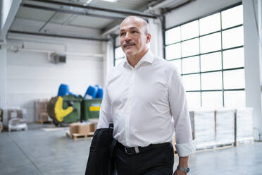 Portrait of a confident businessman in a factory - DIGF09323