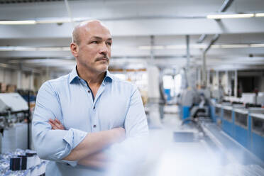 Portrait of a serious businessman in a factory - DIGF09352