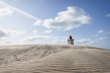 Denmark, Lonstrup, Rippled sand dune with Rubjerg Knude Lighthouse in background - KEBF01468