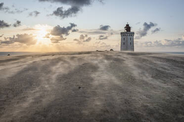 Denmark, Lonstrup, Rubjerg Knude Lighthouse at sunset - KEBF01470