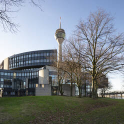 Germany, North Rhine-Westphalia, Dusseldorf, Parliament building with Rheinturm tower in background - WIF04187
